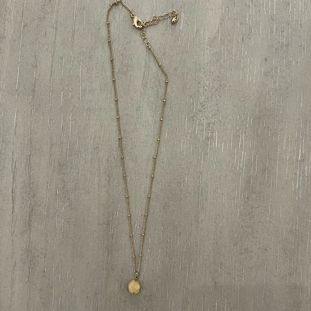 Gold necklace with yellow stone